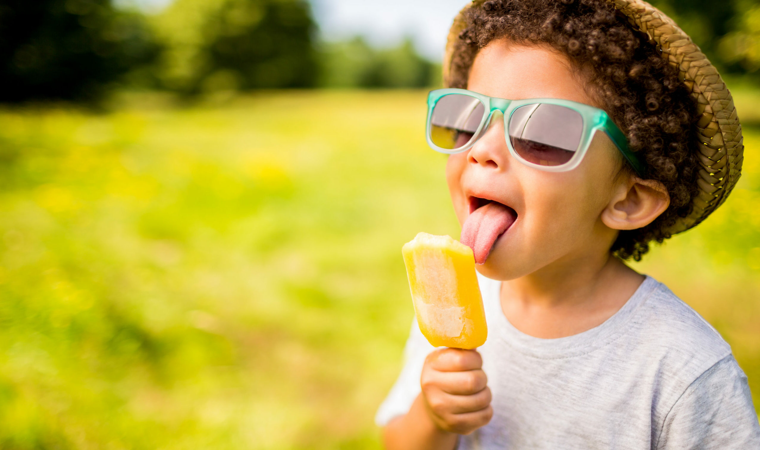 A child enjoying an ice cream in summer.